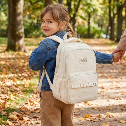 Polka dot ruffled backpack worn